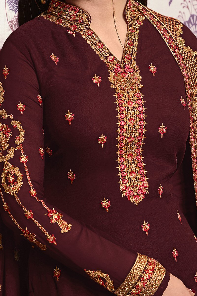 Berry Brown suit with heavy and attractive embroidery and artwork.