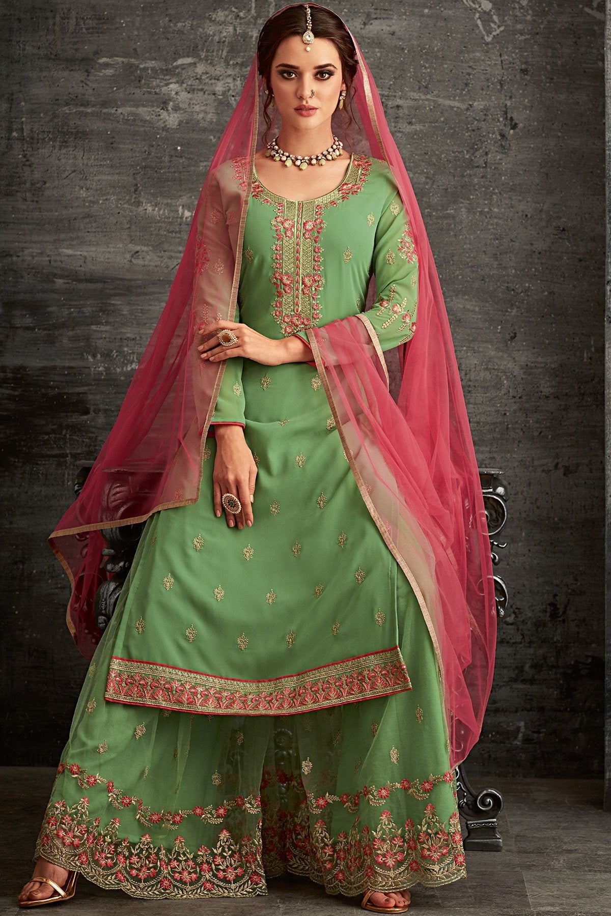 Georgette party wear Sharara suit in Green with Pink Dupatta