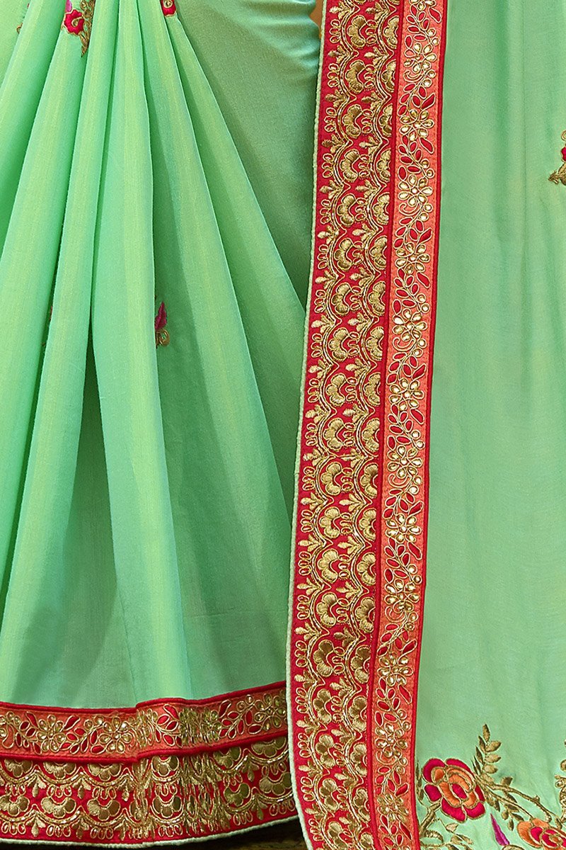 Mint-Green colored Silk Saree with Maroon colored Blouse