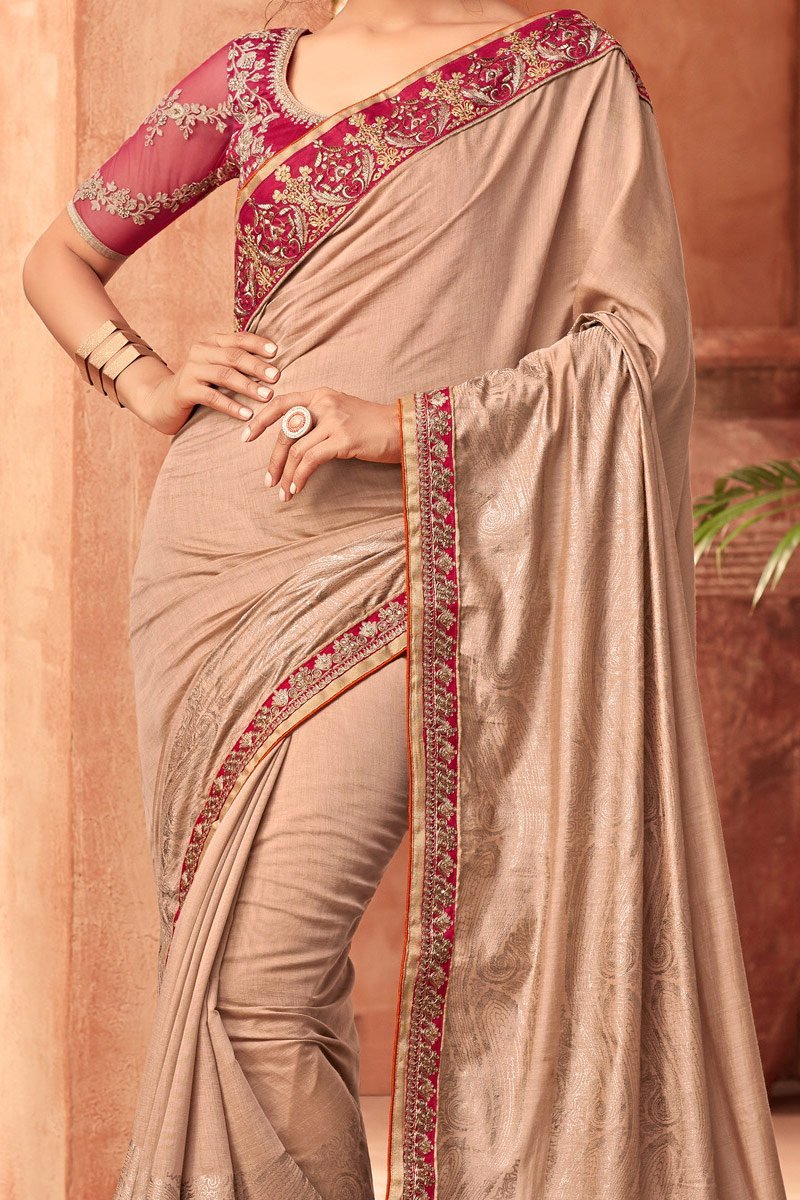 Tortilla-Brown Nyraa Silk saree with Magenta Blouse