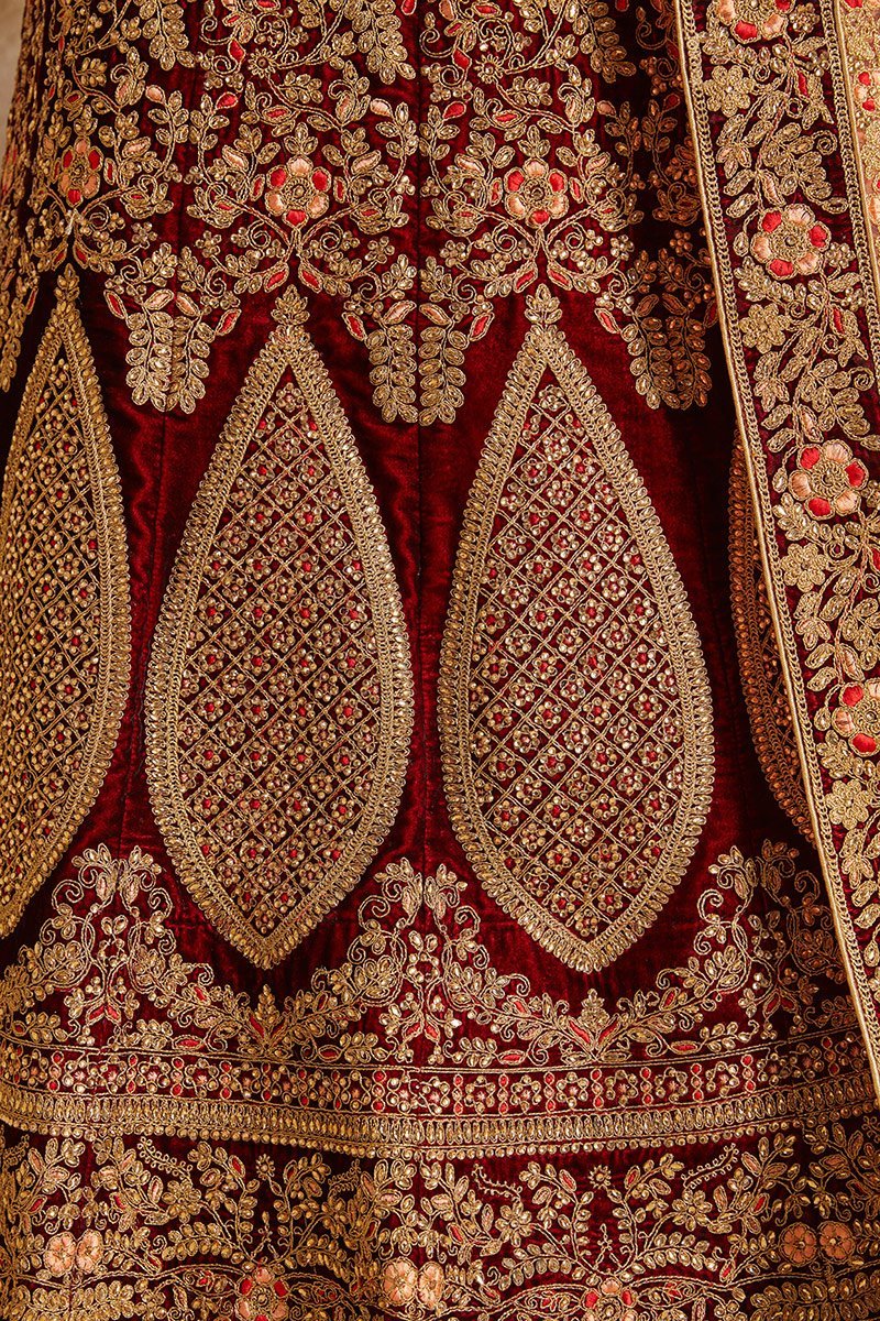 Maroon Lehenga set with elegant threadwork and stonework