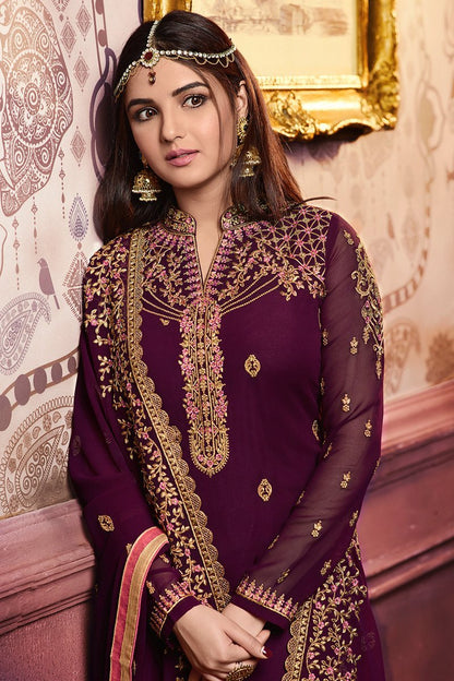 Bergundy Faux Georgette suit with heavy artwork and embroidery