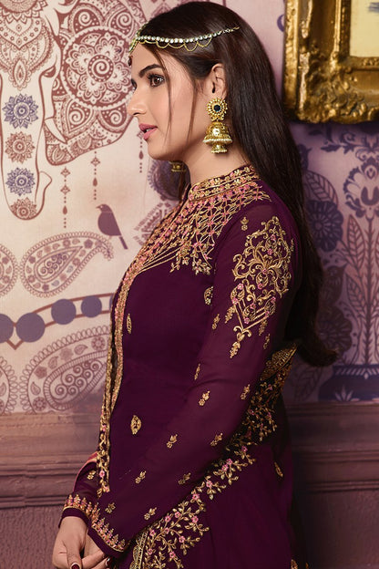 Bergundy Faux Georgette suit with heavy artwork and embroidery