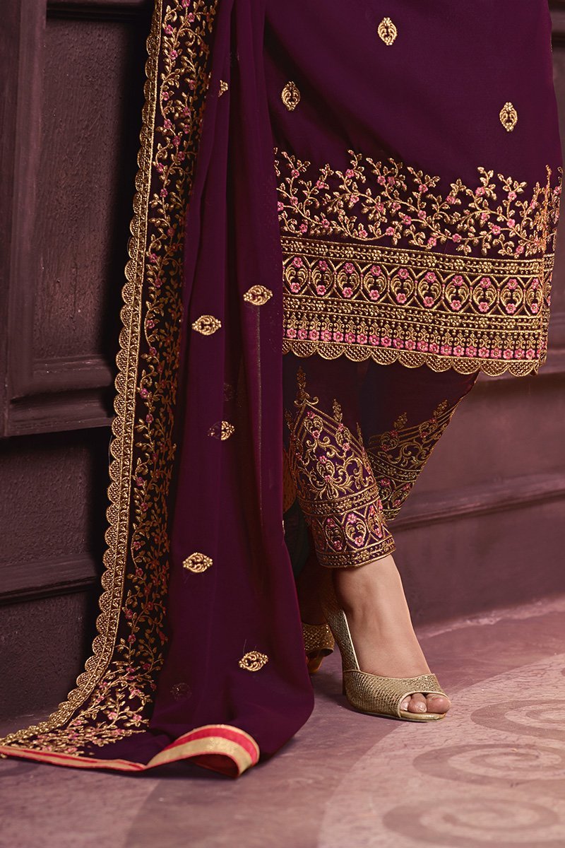 Bergundy Faux Georgette suit with heavy artwork and embroidery