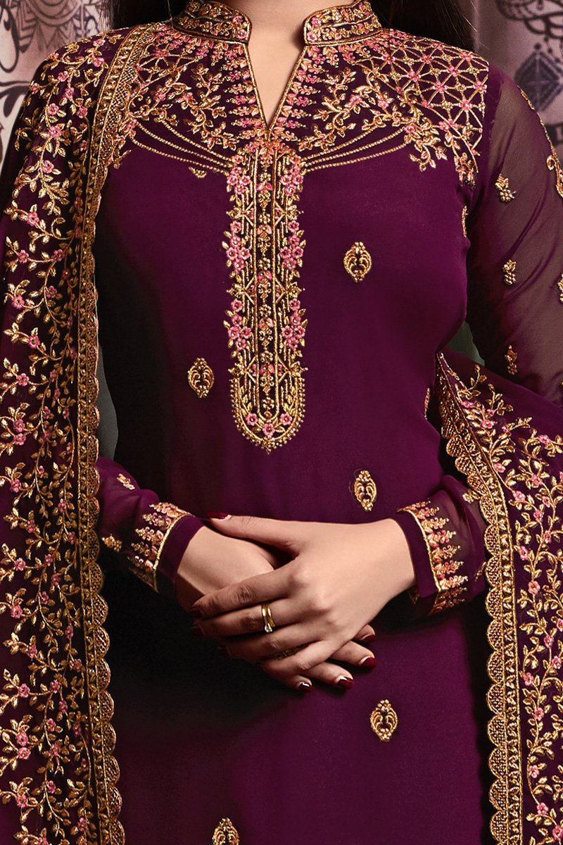 Bergundy Faux Georgette suit with heavy artwork and embroidery