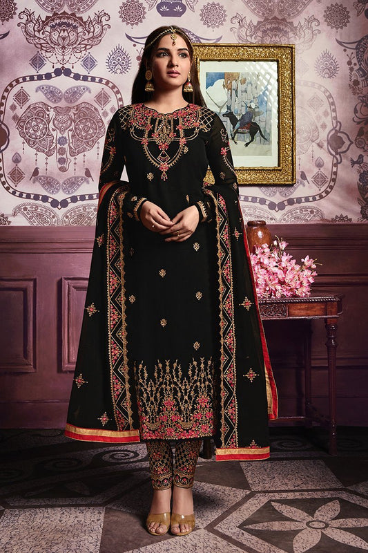 Faux Georgette suit in Midnigh-Black shade with ample of traditional artwork