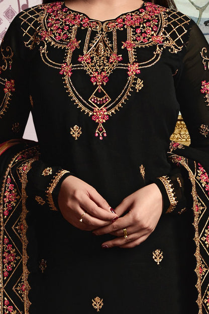 Faux Georgette suit in Midnigh-Black shade with ample of traditional artwork
