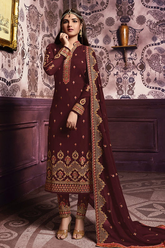 Berry Brown suit with heavy and attractive embroidery and artwork.