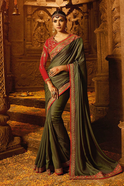 Mehendi-Green colored Silk Saree with Heavy Blouse
