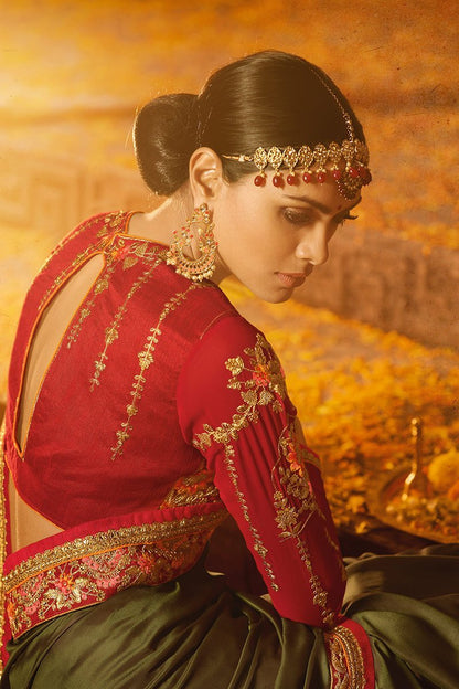 Mehendi-Green colored Silk Saree with Heavy Blouse