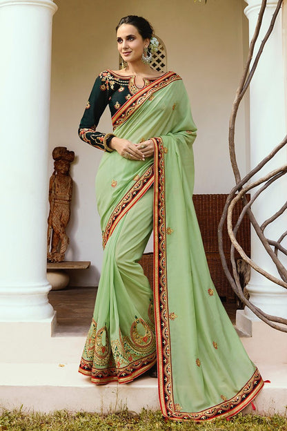 Pista-Green colored Silk Saree with Bottle-Green Blouse