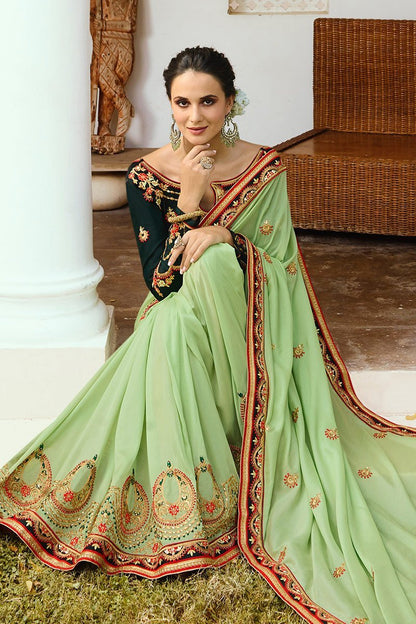 Pista-Green colored Silk Saree with Bottle-Green Blouse