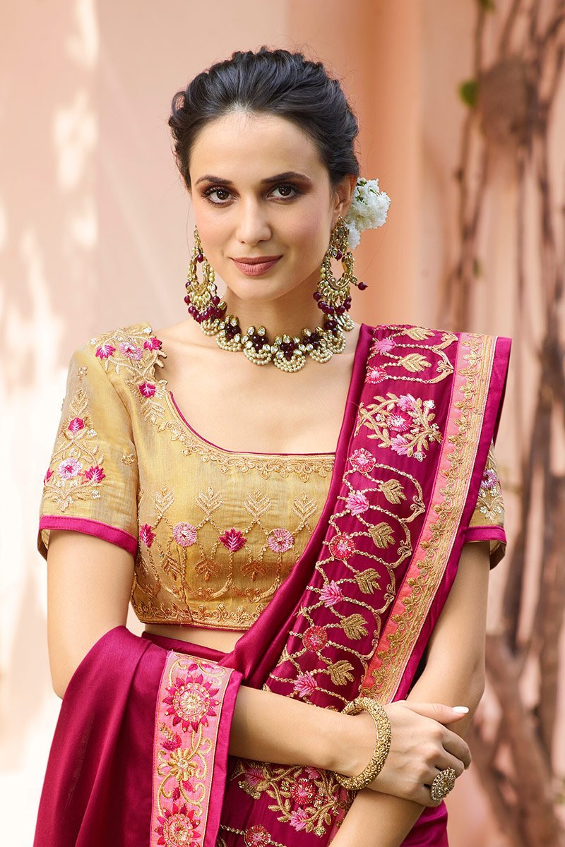 Wine Colored Silk Saree with Gold Colored Blouse