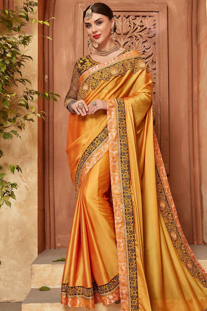 Yellow Saree and Brown Blouse with heavy embroidery