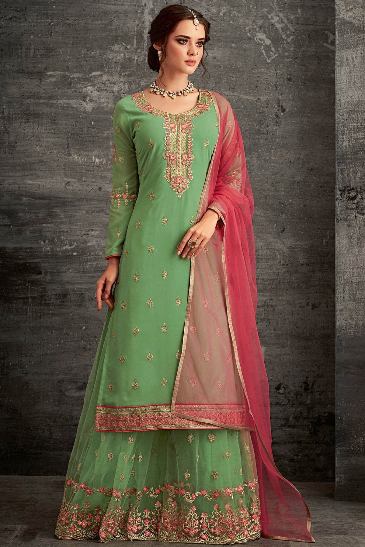 Georgette party wear Sharara suit in Green with Pink Dupatta