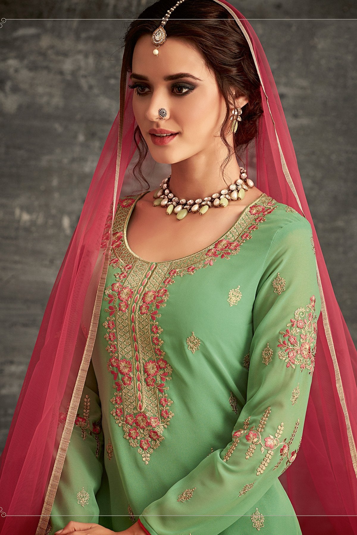 Georgette party wear Sharara suit in Green with Pink Dupatta