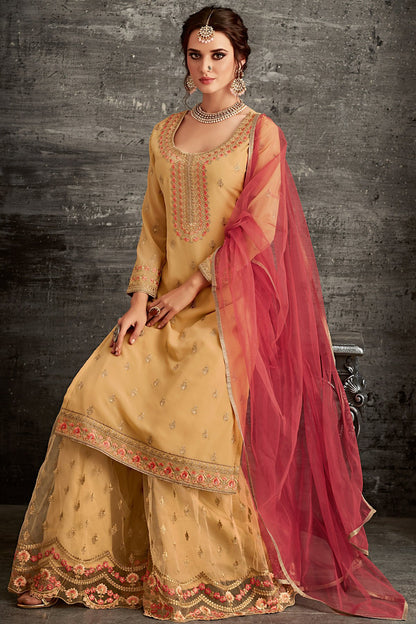 Georgette party wear Sharara suit in Yellow with Pink Dupatta