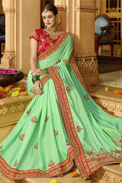 Mint-Green colored Silk Saree with Maroon colored Blouse