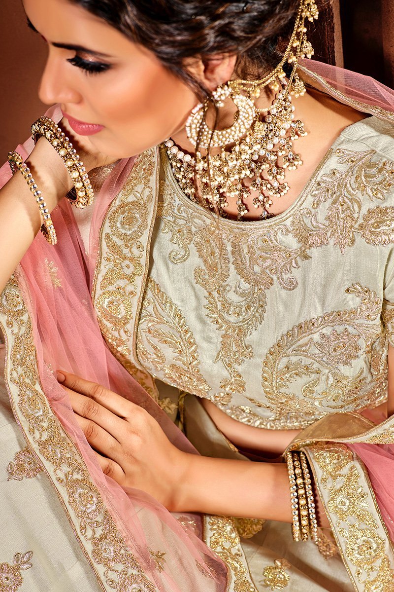 Daazzling White Lehenga set with golden threadwork