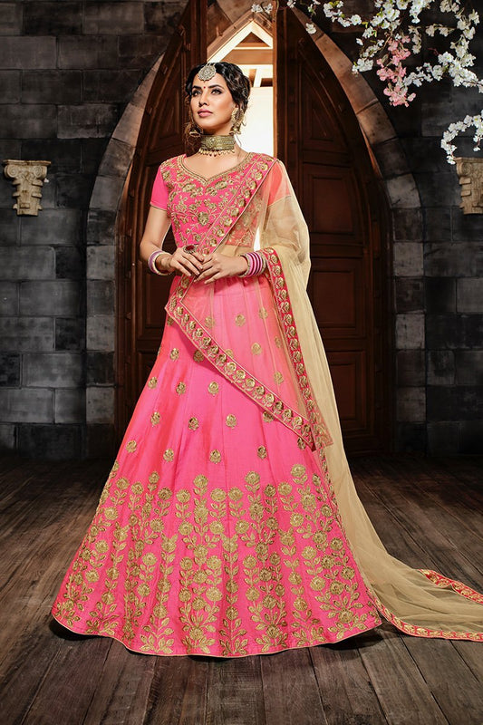 Pink colored lehenga set with lush and well-crafted artwork