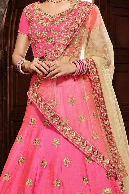 Pink colored lehenga set with lush and well-crafted artwork