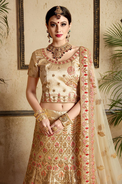 Beige color lehenga set with craftily designed artwork