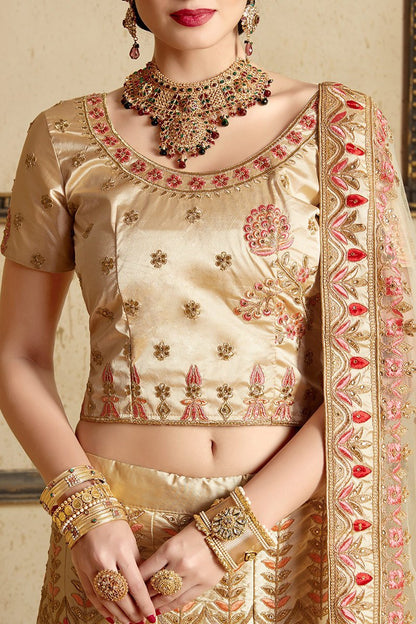 Beige color lehenga set with craftily designed artwork