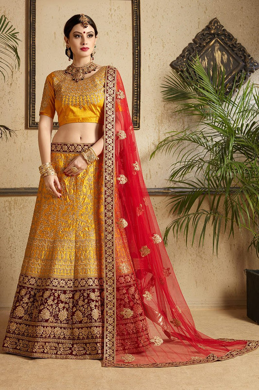 Brown-Red-Yellow colored lehenga set with artistic embroidery of stones stitched in gold thread