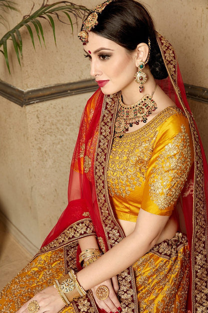 Brown-Red-Yellow colored lehenga set with artistic embroidery of stones stitched in gold thread